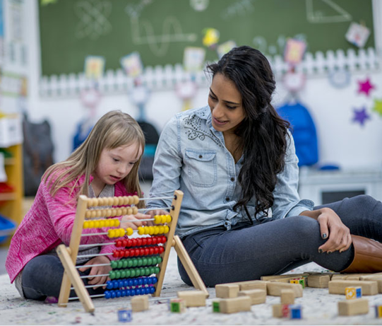 Therapist supporting a child's development